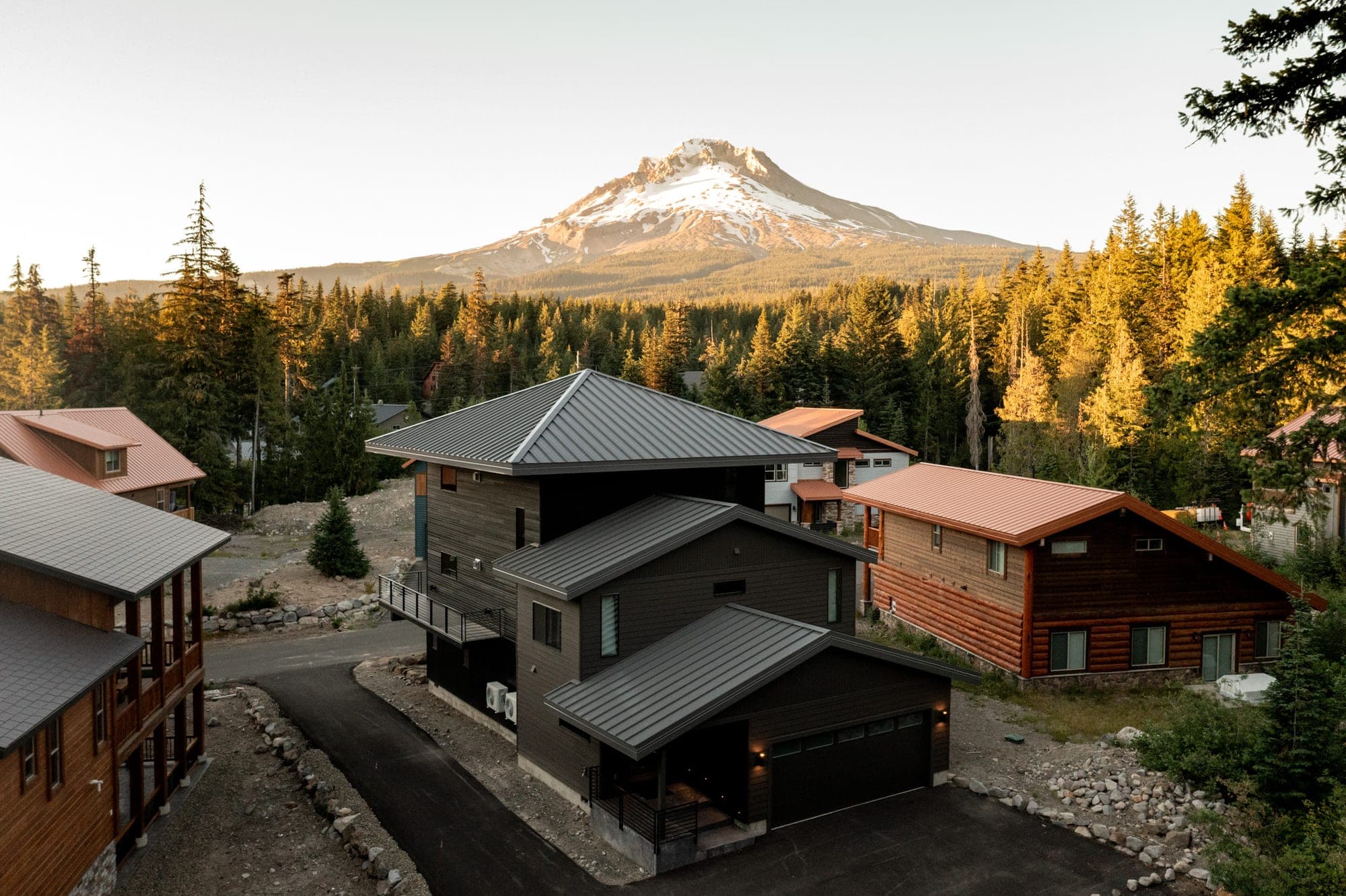 Modern mountain house below Mt. Hood at sunset in Government Camp, OR
