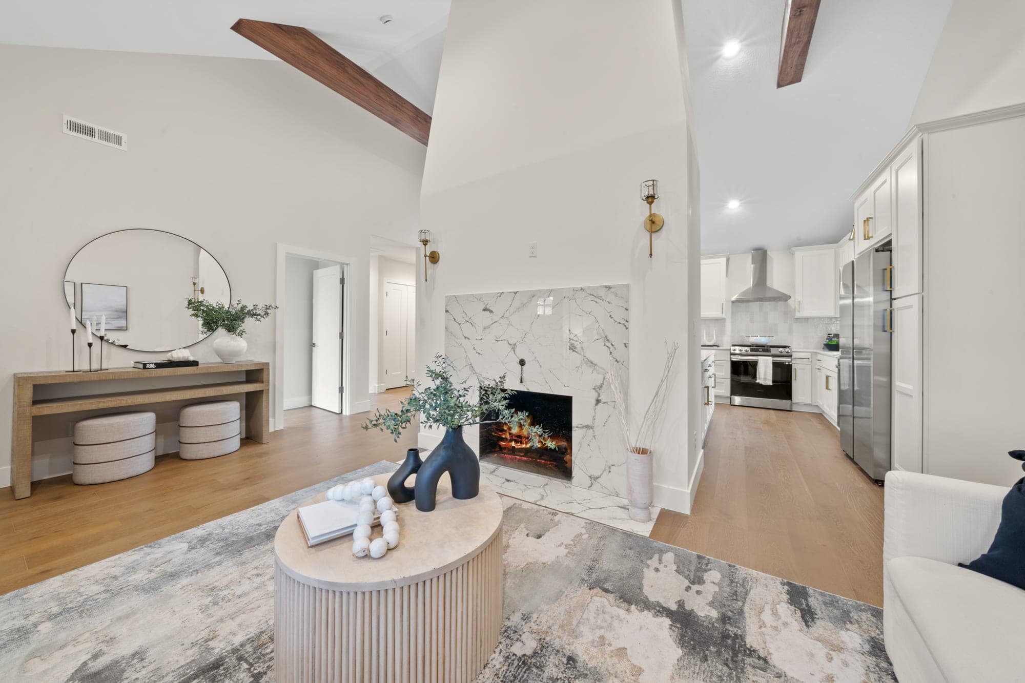 Great room with vaulted ceilings, exposed beams, and hardwood flooring in a 120 year old craftsman in Southwest Portland, OR
